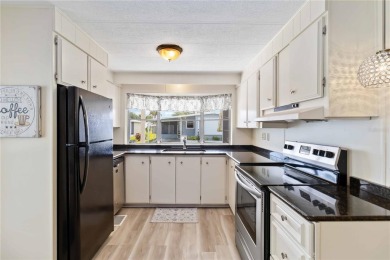 Welcome to a refined slice of paradise in the prestigious on Twin Isles Country Club in Florida - for sale on GolfHomes.com, golf home, golf lot