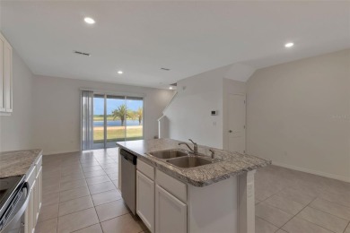 Welcome to this nearly brand-new waterfront townhouse located in on Ridgewood Lakes Golf and Country Club in Florida - for sale on GolfHomes.com, golf home, golf lot