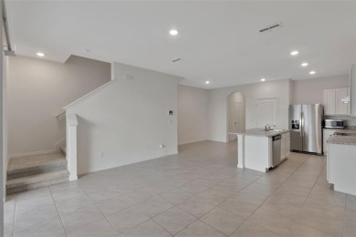 Welcome to this nearly brand-new waterfront townhouse located in on Ridgewood Lakes Golf and Country Club in Florida - for sale on GolfHomes.com, golf home, golf lot