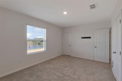 Welcome to this nearly brand-new waterfront townhouse located in on Ridgewood Lakes Golf and Country Club in Florida - for sale on GolfHomes.com, golf home, golf lot