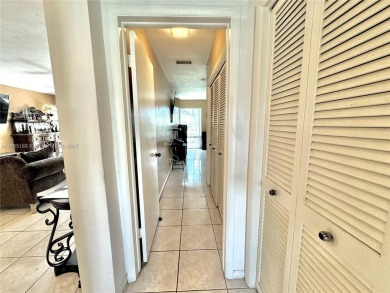 Seller is offering $10,000 towards buyer's closing costs with an on Country Club of Miami in Florida - for sale on GolfHomes.com, golf home, golf lot