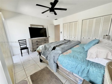 Seller is offering $10,000 towards buyer's closing costs with an on Country Club of Miami in Florida - for sale on GolfHomes.com, golf home, golf lot