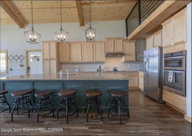 Discover elevated mountain living in this stunning 6-bedroom on Star Valley RV Golf Course in Wyoming - for sale on GolfHomes.com, golf home, golf lot