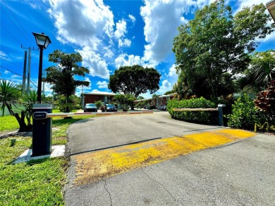 Seller is offering $10,000 towards buyer's closing costs with an on Country Club of Miami in Florida - for sale on GolfHomes.com, golf home, golf lot