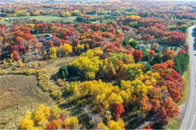 Nearly 3 acres of stunningly beautiful and heavily wooded land on Elk River Golf Club in Minnesota - for sale on GolfHomes.com, golf home, golf lot