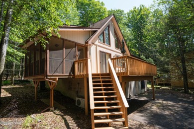 Cozy up in style in this beautifully maintained Poconos chalet on The Hideout Golf in Pennsylvania - for sale on GolfHomes.com, golf home, golf lot