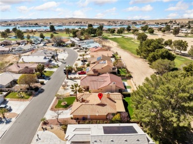 Welcome to 14996 Shady Elm, a warm and inviting 3-bedroom on Silver Lakes Golf Course in California - for sale on GolfHomes.com, golf home, golf lot