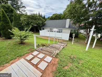 This beautifully renovated ranch-style home is situated in a on Summergrove Golf Club in Georgia - for sale on GolfHomes.com, golf home, golf lot