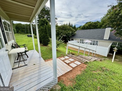 This beautifully renovated ranch-style home is situated in a on Summergrove Golf Club in Georgia - for sale on GolfHomes.com, golf home, golf lot