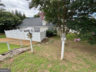 This beautifully renovated ranch-style home is situated in a on Summergrove Golf Club in Georgia - for sale on GolfHomes.com, golf home, golf lot