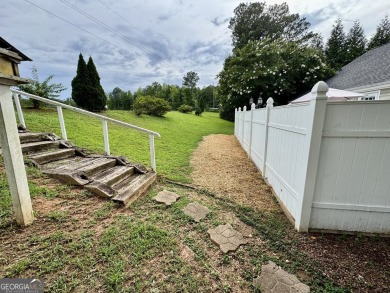 This beautifully renovated ranch-style home is situated in a on Summergrove Golf Club in Georgia - for sale on GolfHomes.com, golf home, golf lot