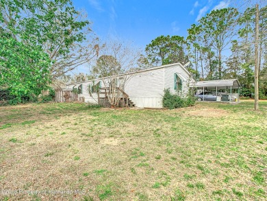 Welcome to this car enthusiasts perfect retreat!! This fantastic on Scotland Yards Golf Club in Florida - for sale on GolfHomes.com, golf home, golf lot