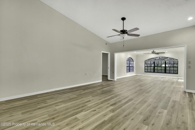 This charming villa, located on the first hole of the Grand on Timber Pines Golf Course in Florida - for sale on GolfHomes.com, golf home, golf lot
