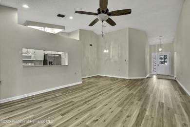 This charming villa, located on the first hole of the Grand on Timber Pines Golf Course in Florida - for sale on GolfHomes.com, golf home, golf lot