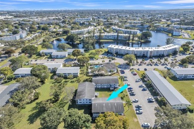 Enjoy peaceful living in this spacious 1-bedroom, 1.5-bath on Hillsboro Pines Golf in Florida - for sale on GolfHomes.com, golf home, golf lot