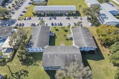 Enjoy peaceful living in this spacious 1-bedroom, 1.5-bath on Hillsboro Pines Golf in Florida - for sale on GolfHomes.com, golf home, golf lot