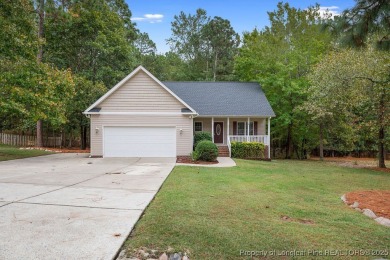 Step inside this charming 3-bedroom, 2-bath home featuring a on Carolina Lakes Country Club in North Carolina - for sale on GolfHomes.com, golf home, golf lot