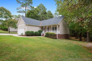 Step inside this charming 3-bedroom, 2-bath home featuring a on Carolina Lakes Country Club in North Carolina - for sale on GolfHomes.com, golf home, golf lot