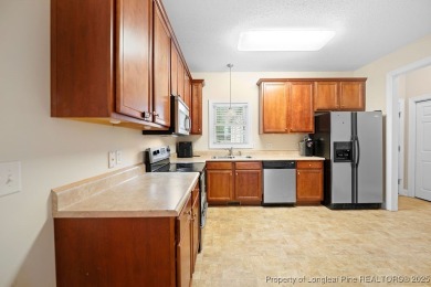 Step inside this charming 3-bedroom, 2-bath home featuring a on Carolina Lakes Country Club in North Carolina - for sale on GolfHomes.com, golf home, golf lot