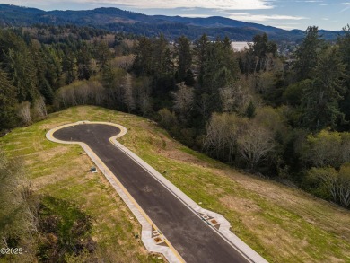 An excellent opportunity to purchase a lot with forested views on Chinook Winds Golf Resort in Oregon - for sale on GolfHomes.com, golf home, golf lot