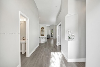 ENJOY LIVING & RELAXING IN THIS GORGEOUS REMODELED HOME WITH on Woodmont Country Club in Florida - for sale on GolfHomes.com, golf home, golf lot