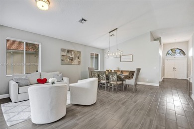 ENJOY LIVING & RELAXING IN THIS GORGEOUS REMODELED HOME WITH on Woodmont Country Club in Florida - for sale on GolfHomes.com, golf home, golf lot