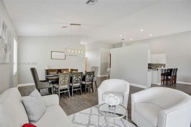 ENJOY LIVING & RELAXING IN THIS GORGEOUS REMODELED HOME WITH on Woodmont Country Club in Florida - for sale on GolfHomes.com, golf home, golf lot