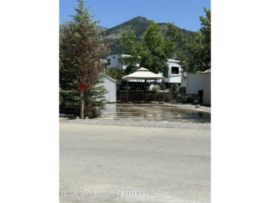 Great RV Pad with mature landscaping, Mountain views,  concrete on Star Valley RV Golf Course in Wyoming - for sale on GolfHomes.com, golf home, golf lot