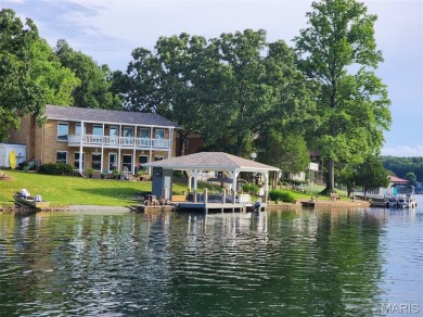 Enjoy stunning sunset lake views from this charming all-brick on Terre Du Lac Golf and Country Club in Missouri - for sale on GolfHomes.com, golf home, golf lot