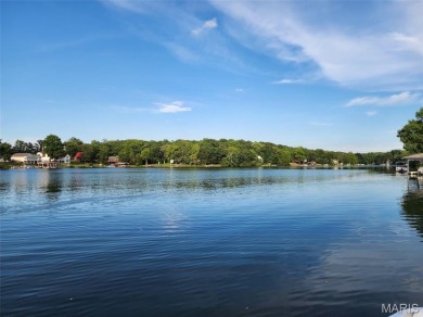 Enjoy stunning sunset lake views from this charming all-brick on Terre Du Lac Golf and Country Club in Missouri - for sale on GolfHomes.com, golf home, golf lot