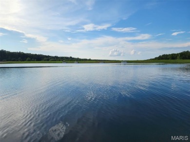 Enjoy stunning sunset lake views from this charming all-brick on Terre Du Lac Golf and Country Club in Missouri - for sale on GolfHomes.com, golf home, golf lot