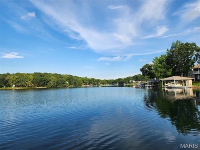 Enjoy stunning sunset lake views from this charming all-brick on Terre Du Lac Golf and Country Club in Missouri - for sale on GolfHomes.com, golf home, golf lot