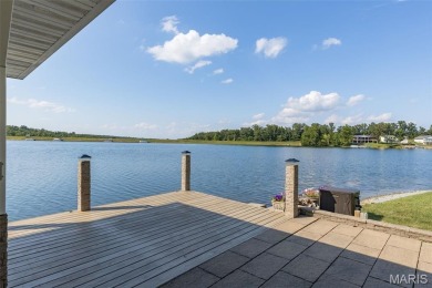Enjoy stunning sunset lake views from this charming all-brick on Terre Du Lac Golf and Country Club in Missouri - for sale on GolfHomes.com, golf home, golf lot