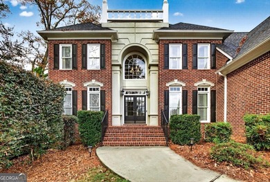 This stunning home in the prestigious gated with security guard on Whitewater Creek in Georgia - for sale on GolfHomes.com, golf home, golf lot