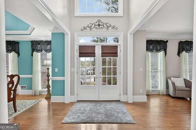This stunning home in the prestigious gated with security guard on Whitewater Creek in Georgia - for sale on GolfHomes.com, golf home, golf lot
