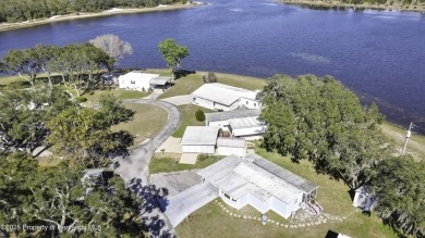 Welcome to paradise!  This lakefront home on Tooke Lake is on Glen Lakes Country Club in Florida - for sale on GolfHomes.com, golf home, golf lot