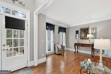 This stunning home in the prestigious gated with security guard on Whitewater Creek in Georgia - for sale on GolfHomes.com, golf home, golf lot