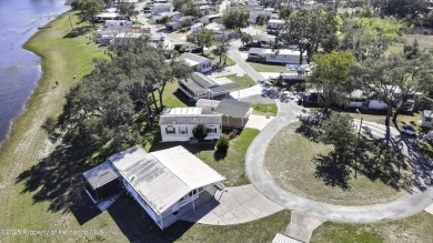 Welcome to paradise!  This lakefront home on Tooke Lake is on Glen Lakes Country Club in Florida - for sale on GolfHomes.com, golf home, golf lot