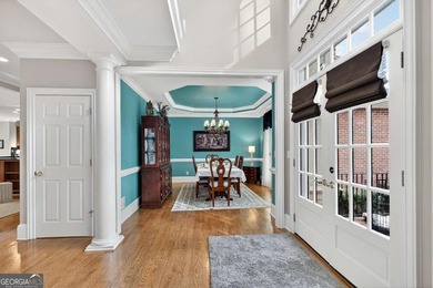 This stunning home in the prestigious gated with security guard on Whitewater Creek in Georgia - for sale on GolfHomes.com, golf home, golf lot