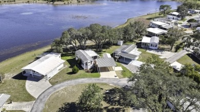 Welcome to paradise!  This lakefront home on Tooke Lake is on Glen Lakes Country Club in Florida - for sale on GolfHomes.com, golf home, golf lot