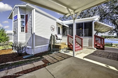 Welcome to paradise!  This lakefront home on Tooke Lake is on Glen Lakes Country Club in Florida - for sale on GolfHomes.com, golf home, golf lot