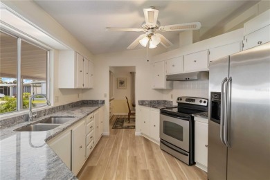 Welcome to this exquisitely remodeled residence in the highly on Twin Isles Country Club in Florida - for sale on GolfHomes.com, golf home, golf lot