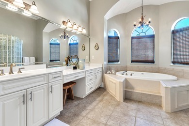 Tucked away within the highly sought-after-gated community of on Emerald Bay Golf Club in Florida - for sale on GolfHomes.com, golf home, golf lot