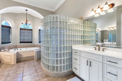 Tucked away within the highly sought-after-gated community of on Emerald Bay Golf Club in Florida - for sale on GolfHomes.com, golf home, golf lot