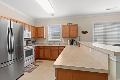 This charming 2-bedroom, 2-bathroom second-floor end unit is on Barefoot Resort and Golf Club  in South Carolina - for sale on GolfHomes.com, golf home, golf lot