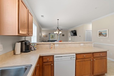 This charming 2-bedroom, 2-bathroom second-floor end unit is on Barefoot Resort and Golf Club  in South Carolina - for sale on GolfHomes.com, golf home, golf lot