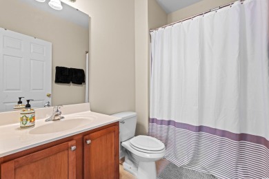 This charming 2-bedroom, 2-bathroom second-floor end unit is on Barefoot Resort and Golf Club  in South Carolina - for sale on GolfHomes.com, golf home, golf lot