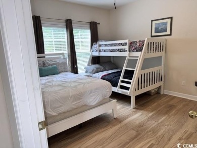 This charming 2-bedroom, 2-bathroom second-floor end unit is on Barefoot Resort and Golf Club  in South Carolina - for sale on GolfHomes.com, golf home, golf lot