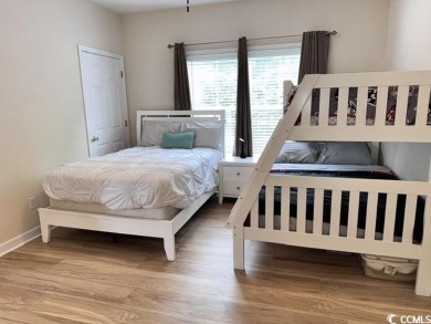 This charming 2-bedroom, 2-bathroom second-floor end unit is on Barefoot Resort and Golf Club  in South Carolina - for sale on GolfHomes.com, golf home, golf lot