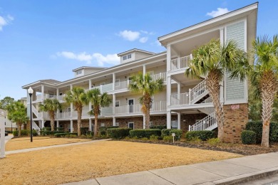 This charming 2-bedroom, 2-bathroom second-floor end unit is on Barefoot Resort and Golf Club  in South Carolina - for sale on GolfHomes.com, golf home, golf lot